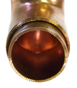 Close-up of clean pipe interior, demonstrating effectiveness of ScaleBlaster in preventing scale. 