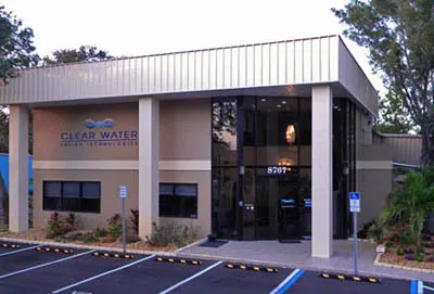 Exterior of ScaleBlaster’s ClearWater Tech headquarters with logo and modern glass entryway.